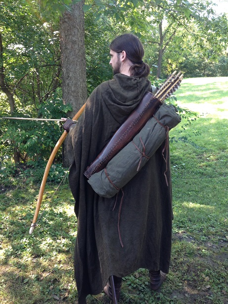 I decided to make to small slits in my cloak to make carrying my bedroll and quiver easier.